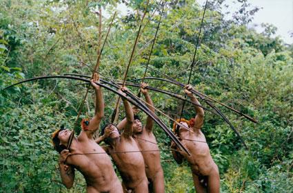 Awá men hunting in the forest